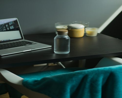 Fresh water carafe on an office desk symbolizing conscious daily hydration rituals
