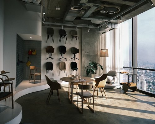 An open interior coworking lounge in Jakarta with diffused ambient ceiling lights