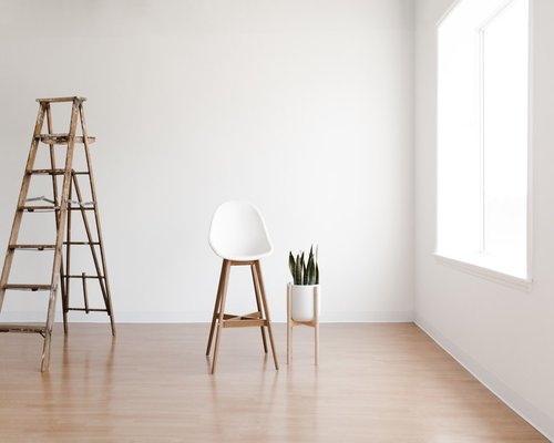 A bright minimal room utilizing diffuse natural light for comfortable reading and computer work